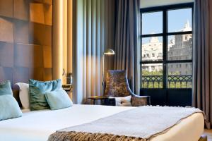 A bed or beds in a room at Hotel Condes de Barcelona