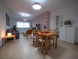 a kitchen and living room with a table and chairs at Apartamento nuevo con WiFi in Frontera