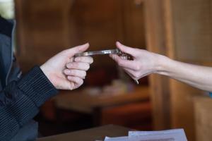 a man and woman holding a thermometer in their hands at CGH Résidences & Spas Le Hameau Du Beaufortain in Les Saisies