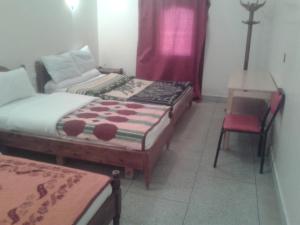 Postel nebo postele na pokoji v ubytování Hotel Almanader