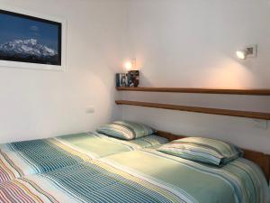 Katil atau katil-katil dalam bilik di Apartamentos El Faro