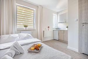 Łóżko lub łóżka w pokoju w obiekcie Apartamenty Novomiejska 17