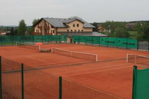 a tennis court with two tennis nets on it at Sportpenzion Pohoda in Pilsen