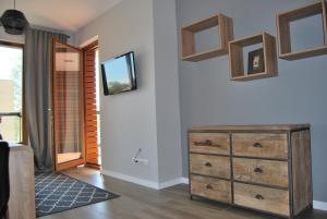 Televisyen dan/atau pusat hiburan di Ambar Apartament