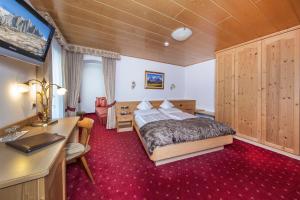 Postel nebo postele na pokoji v ubytování Garni La Majon + 37 fotografií