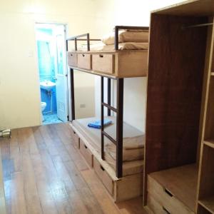 Postel nebo postele na pokoji v ubytování Cebu Pungko-pungko Hostel