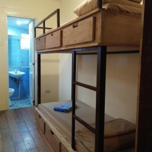 Postel nebo postele na pokoji v ubytování Cebu Pungko-pungko Hostel
