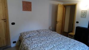 Postel nebo postele na pokoji v ubytování Cantina Alpina