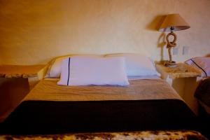 Postel nebo postele na pokoji v ubytování Hotel Posada Primavera