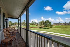 a porch with a view of the ocean at St George Inn - Saint Augustine in Saint Augustine