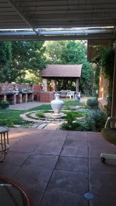 a patio with a large vase in a yard at The Nest in Bethlehem