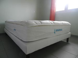 a mattress sitting on a bed in a room at Coco D'Iles in Terre-de-Bas