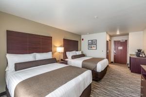 Voodi või voodid majutusasutuse Cobblestone Hotel & Suites - Stevens Point toas