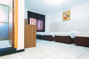 Postel nebo postele na pokoji v ubytování Hotel Holiday Foz