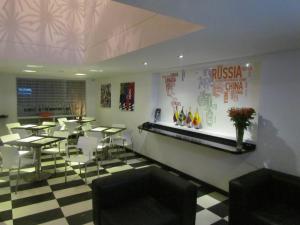 a restaurant with tables and chairs in a room at Hotel Classic in Bogotá