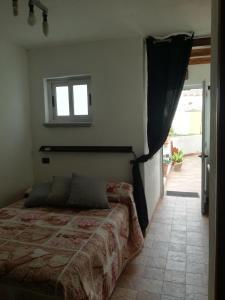 Uma cama ou camas num quarto em B&B PompeiLog