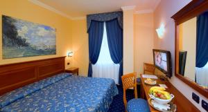 Postel nebo postele na pokoji v ubytování Albergo Costantini