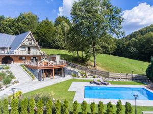 an aerial view of a house with a swimming pool at Dom Beskidy in Brenna