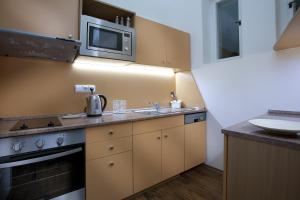 Kuchyň nebo kuchyňský kout v ubytování Anyday Apartments