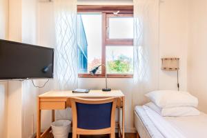 Postel nebo postele na pokoji v ubytování Västerbacken Hotell & Konferens