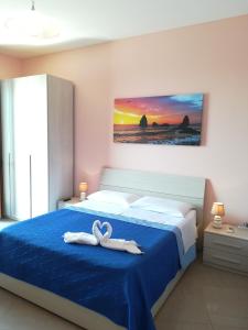 Postel nebo postele na pokoji v ubytování B&B la spiaggetta di Stazzo