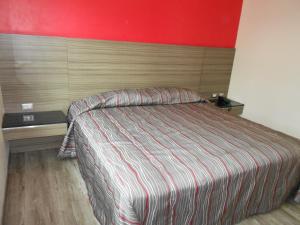 Voodi või voodid majutusasutuse Hotel Dharma toas