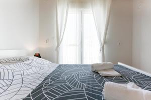 Postel nebo postele na pokoji v ubytování Diva Apartment