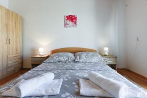 Postel nebo postele na pokoji v ubytování Diva Apartment