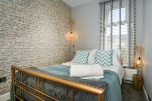 Ένα ή περισσότερα κρεβάτια σε δωμάτιο στο House for Families or Groups near Cardiff City Centre