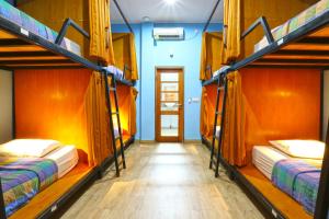Postel nebo postele na pokoji v ubytování New Ubud Hostel