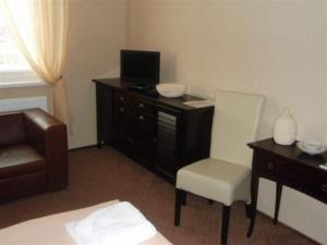 TV a/nebo společenská místnost v ubytování Hotel Galileo