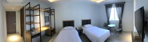Rúm í herbergi á Hotel Arisu