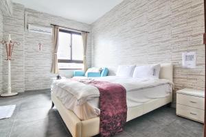 Ein Bett oder Betten in einem Zimmer der Unterkunft Yixiang Spring Travel