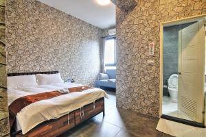 Ein Bett oder Betten in einem Zimmer der Unterkunft Yixiang Spring Travel