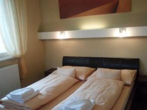 מיטה או מיטות בחדר ב-Hotel Galileo