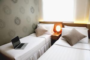 Säng eller sängar i ett rum på Bridal Tea House Hotel - Yaumatei