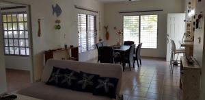 a living room with a couch and a table at Casa De Los Peces in San Crisanto