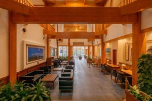 a long hallway with tables and chairs in a building at Hotel Shiki no Yakata Nasu in Nasu