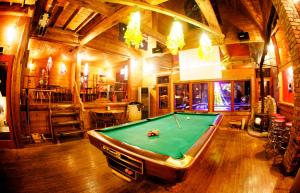 a room with a pool table and a bar at Sumika in Furano