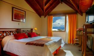 Giường trong phòng chung tại Terraza Coirones Hotel