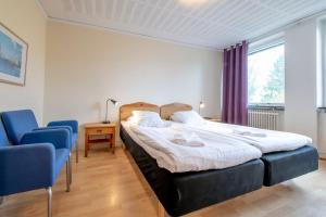 Postel nebo postele na pokoji v ubytování Västerbacken Hotell & Konferens