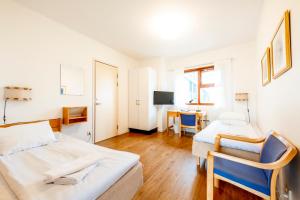 Postel nebo postele na pokoji v ubytování Västerbacken Hotell & Konferens