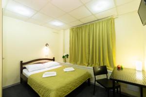 Кровать или кровати в номере Izmailovskiy Mini-Hotel