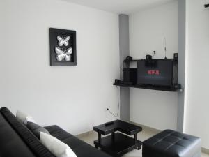 TV a/nebo společenská místnost v ubytování Santa Isabel Centro 401