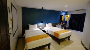 Postel nebo postele na pokoji v ubytování Tharapark View Hotel - SHA Plus