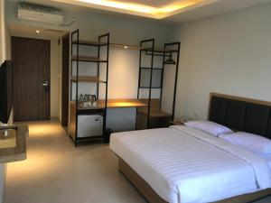 Rúm í herbergi á Hotel Arisu