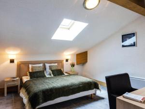 En eller flere senge i et værelse på Résidence Goélia Le Grand Ermitage