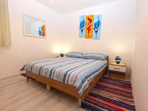 A bed or beds in a room at Apartment Vinkuran 1181