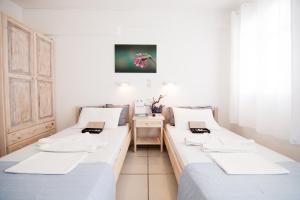 מיטה או מיטות בחדר ב-Alea Apartments