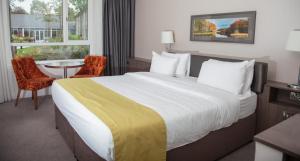 Uma cama ou camas num quarto em Hotel Kilmore